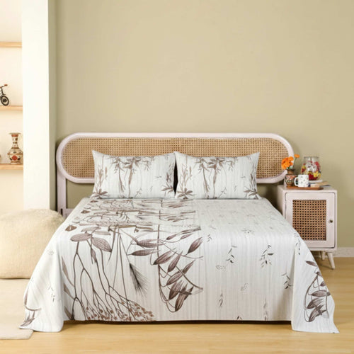Bed with floral bedding in a bedroom setting