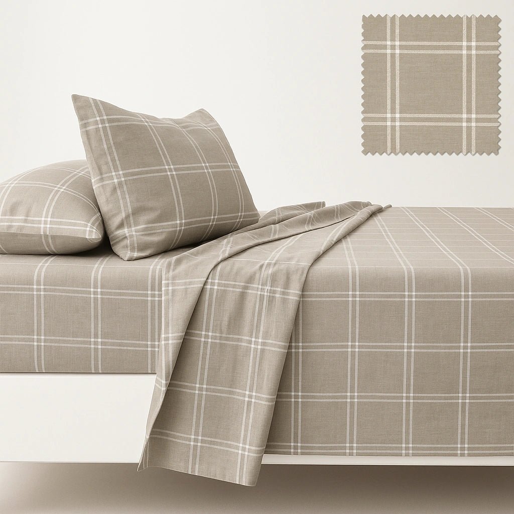 Plaid bedspread with matching pillows on a plain background